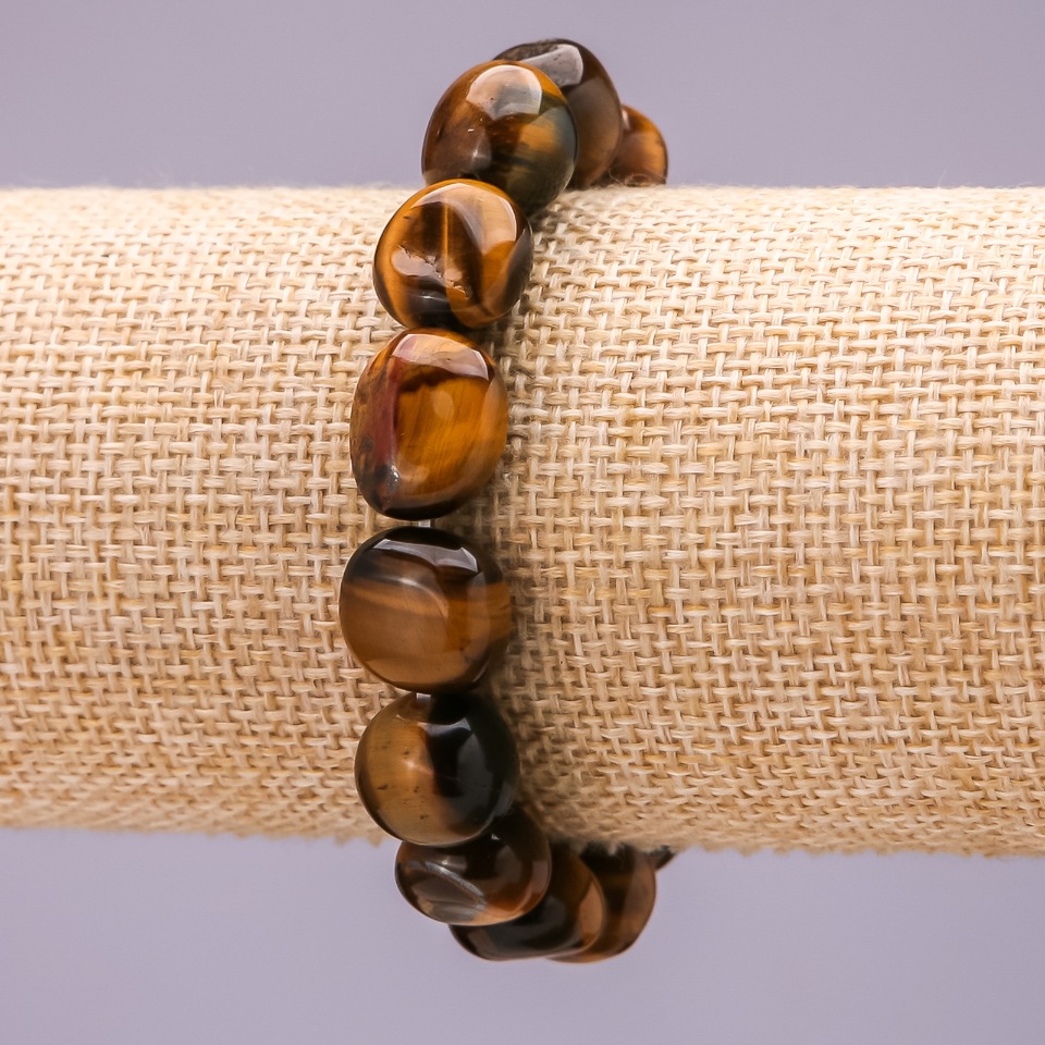Elastic bracelet with Tiger's Eye, faceted 12×8 mm (±)