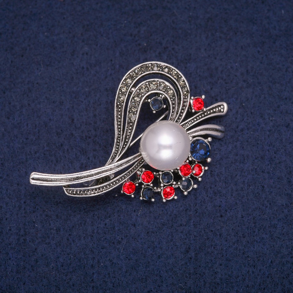 Brooch 'Accent' with a bead and crystals, Gray metal