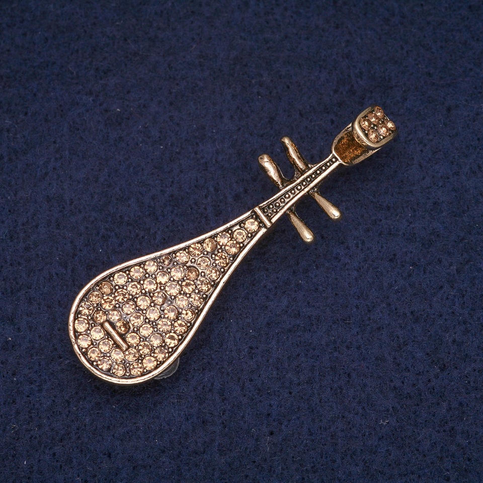 Brooch 'Pipa' with yellow rhinestones, gold-tone metal 15x50mm