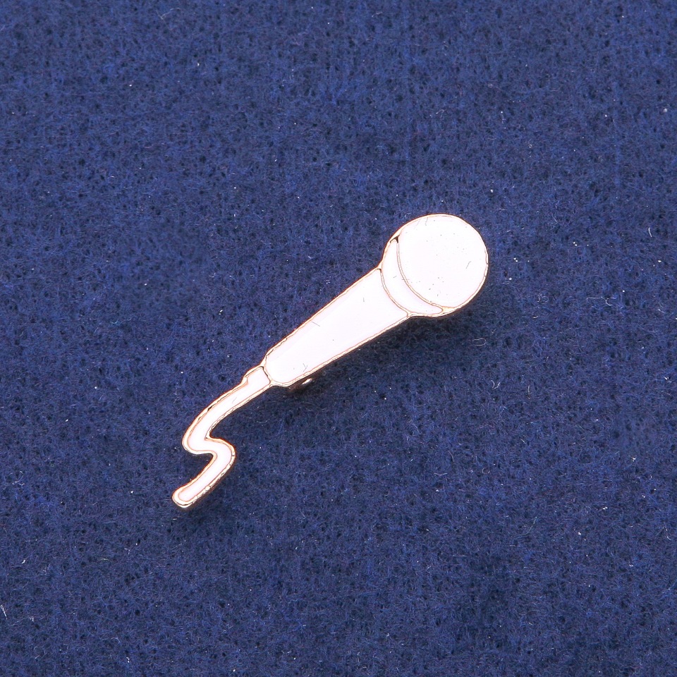 Brooch 'Microphone' with white enamel and gold-tone metal 10×41 mm
