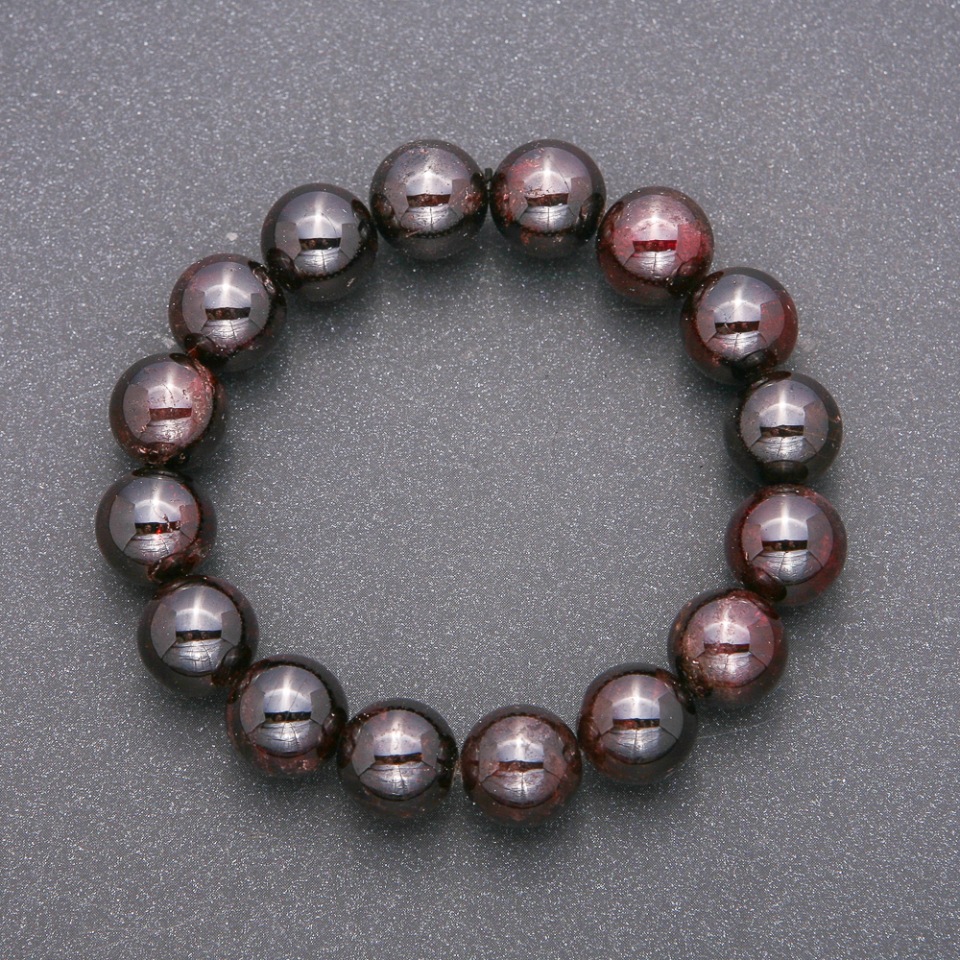 Bracelet with natural garnet gemstone on elastic cord, smooth beads, diameter 12 mm (±), length 18 cm
