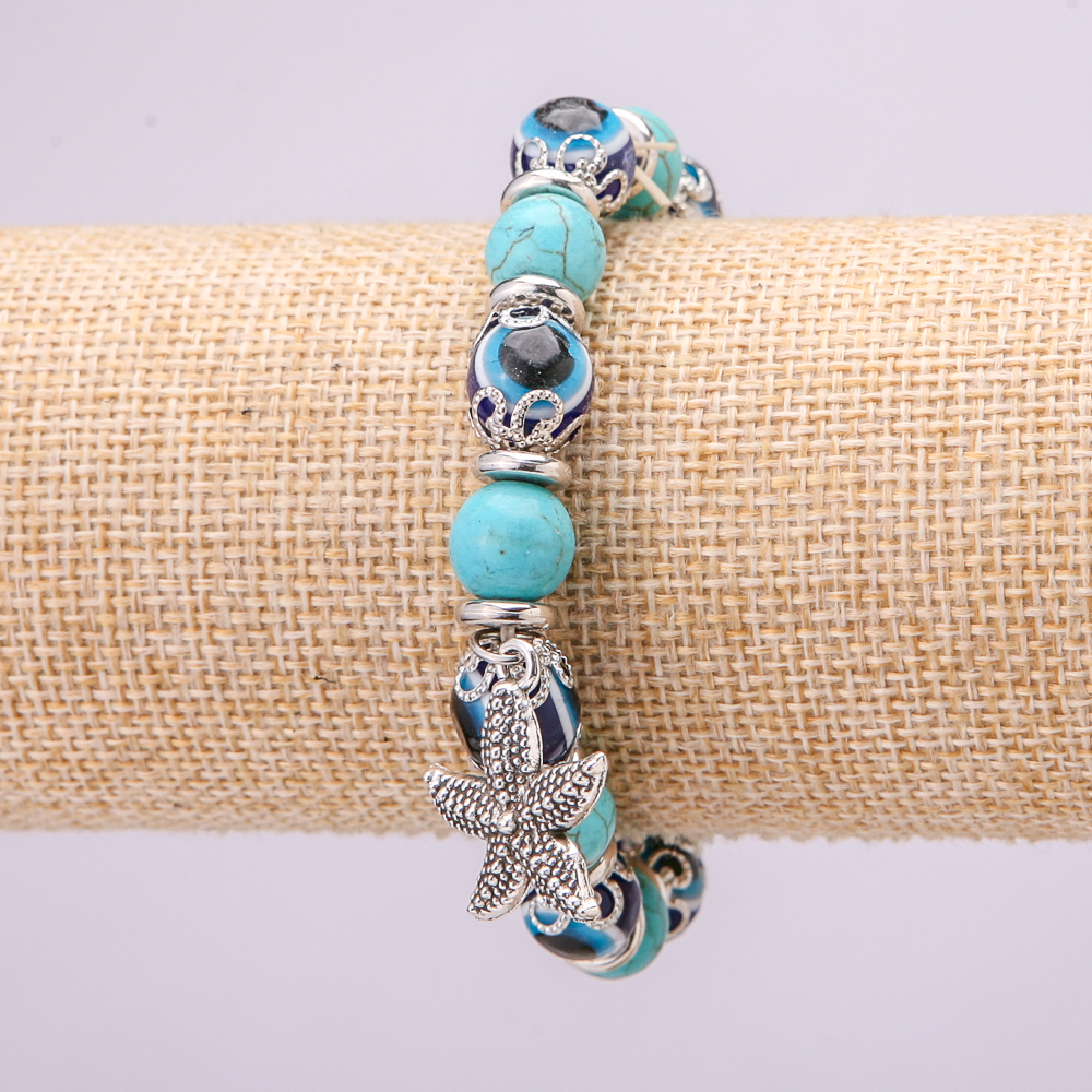 Turquoise protective bracelet with blue eyes on elastic, diameter approx. 10 mm, length 18 cm with inserts and a Sea Star pendant