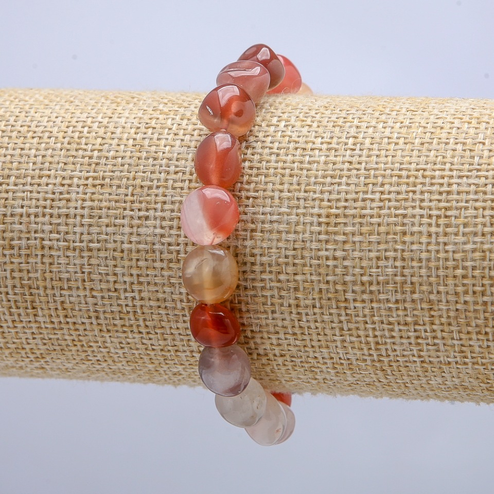 Elastic carnelian bracelet, faceted beads, diameter 9x7 mm, circumference 18 cm +