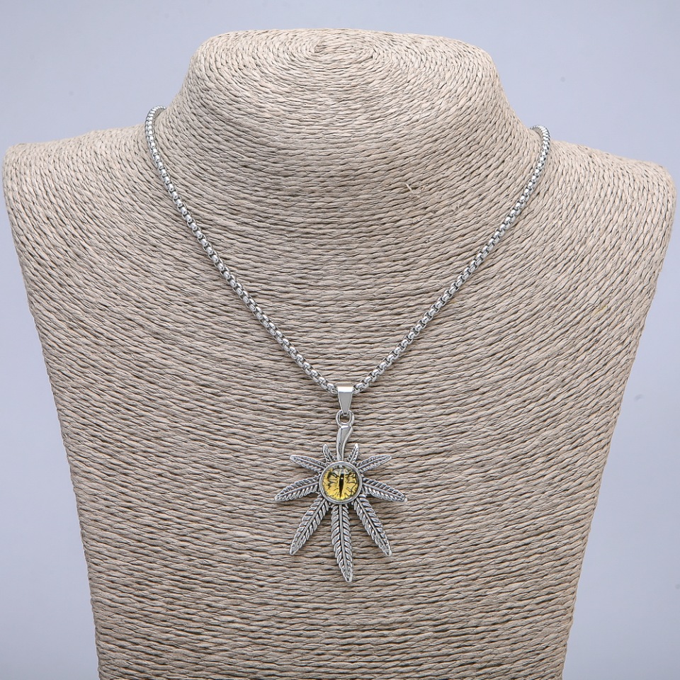 Pendant Hemp Leaf with Dragon Eye, 38×55 mm, on a chain, 65 cm long, silver metal color