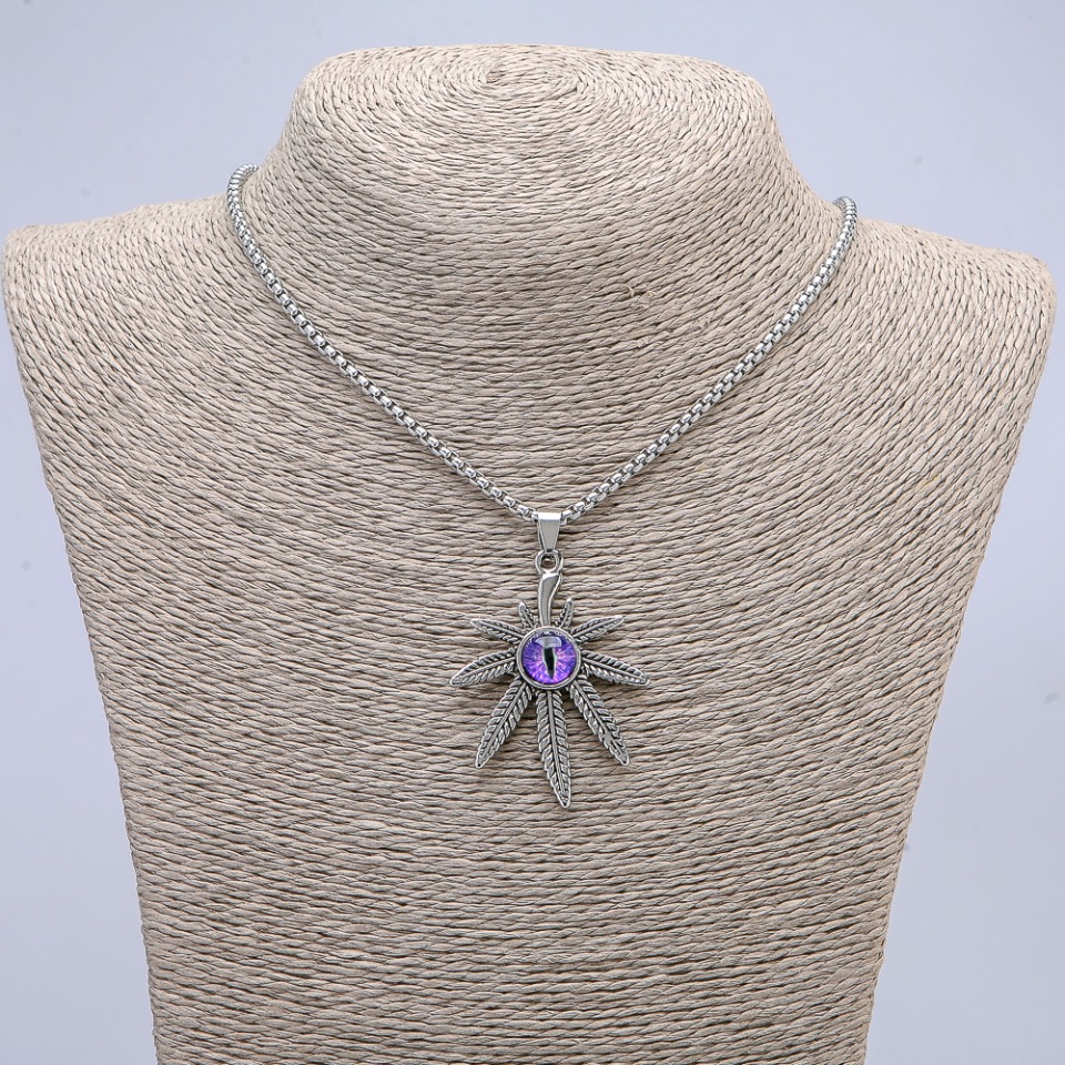 Pendant 'Hemp Leaf with Dragon Eye' 38×55 mm on chain, length 65 cm, silver-colored metal
