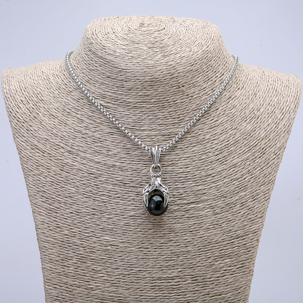 Pendant 'Paw with Sphere' 45x15 mm + - on a chain, length 70 cm + - silver metal