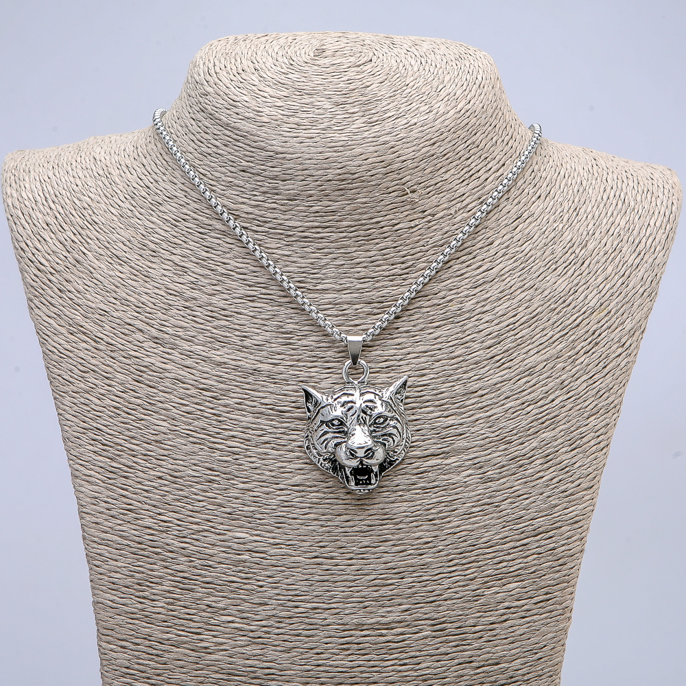 Pendant 'Tiger Head' 45x30 mm on chain, length 70 cm, silvery metal