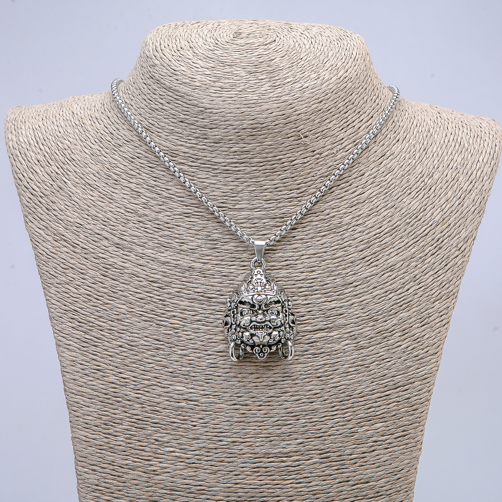 Pendant 'Mahakala' 40×30 mm on a chain, length 70 cm, silver-toned metal