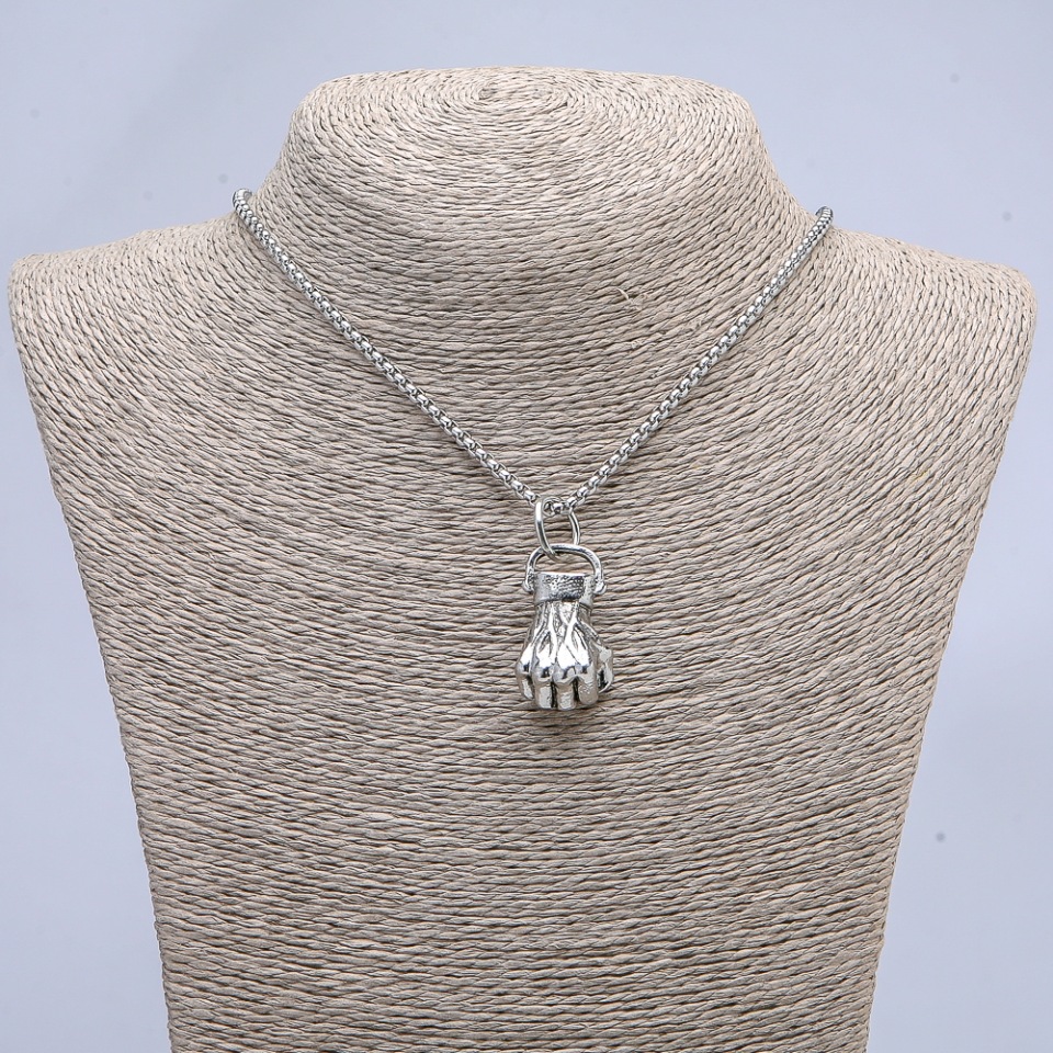 Pendant 'Fist' 40x18mm on a chain, length 70 cm ± silver-colored metal