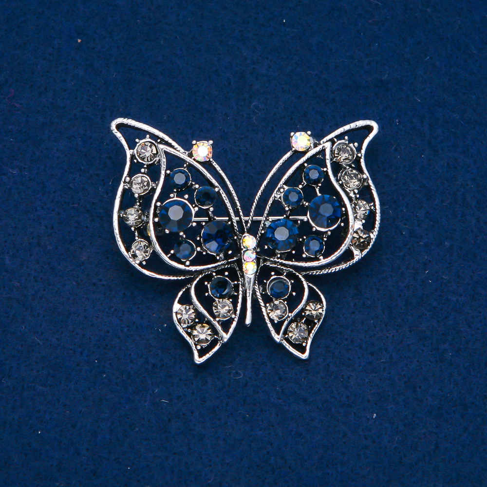 Butterfly Brooch in silvery metal with blue, gray, white, and gasoline-colored crystals, 46x52 mm +