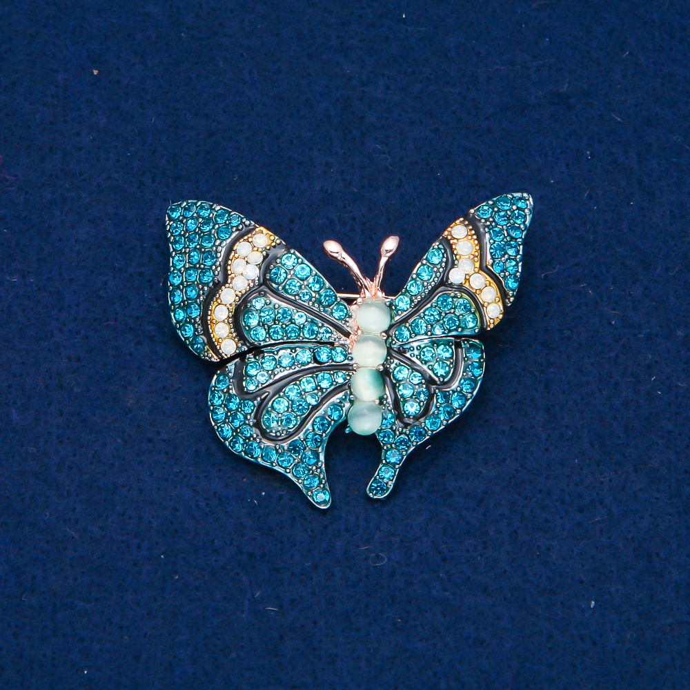 Gold-tone metal butterfly brooch, blue and white rhinestones and beads, 37x45 mm +