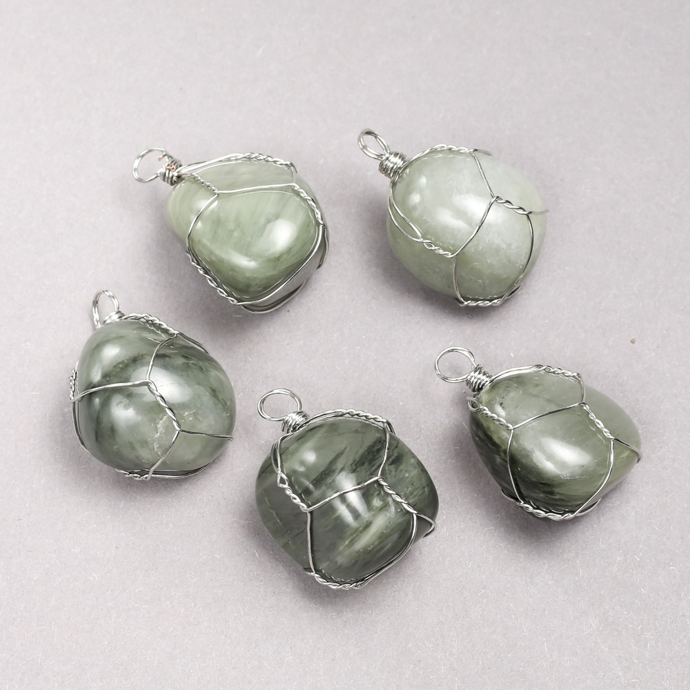 Pendant in a silver weave with natural Seraphinite stone, diameter 35x20 mm+