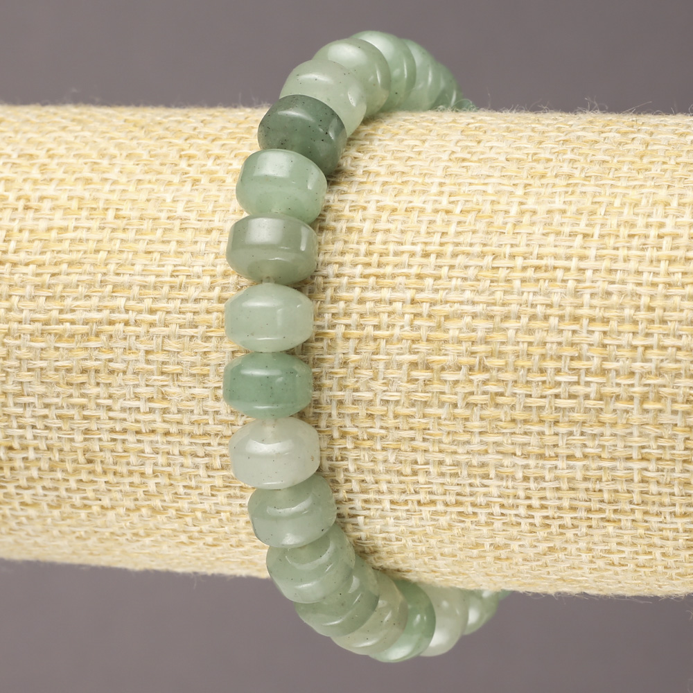 Elastic bracelet of natural jade with smooth rondels, diameter 9×7 mm