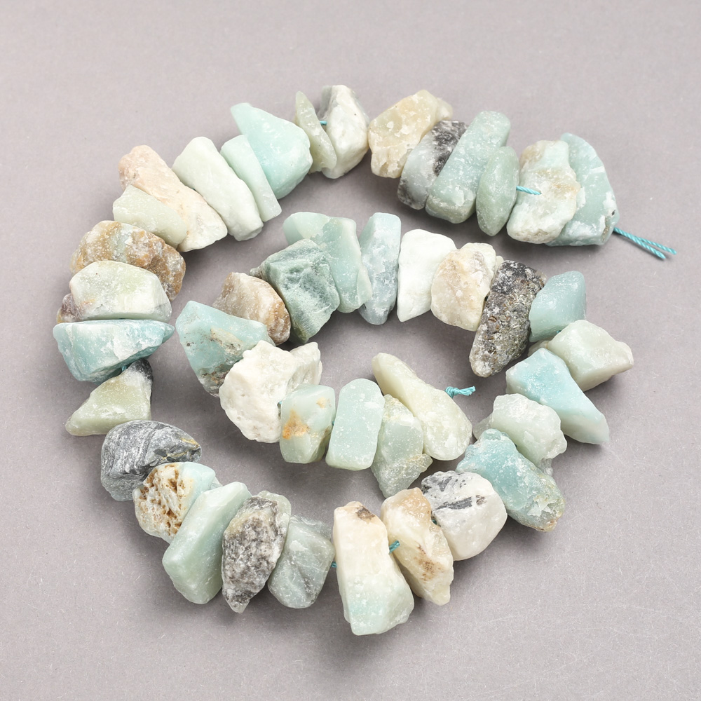Unpolished Amazonite beads on a haltivka thread, 10x20 mm diameter, 42 cm length