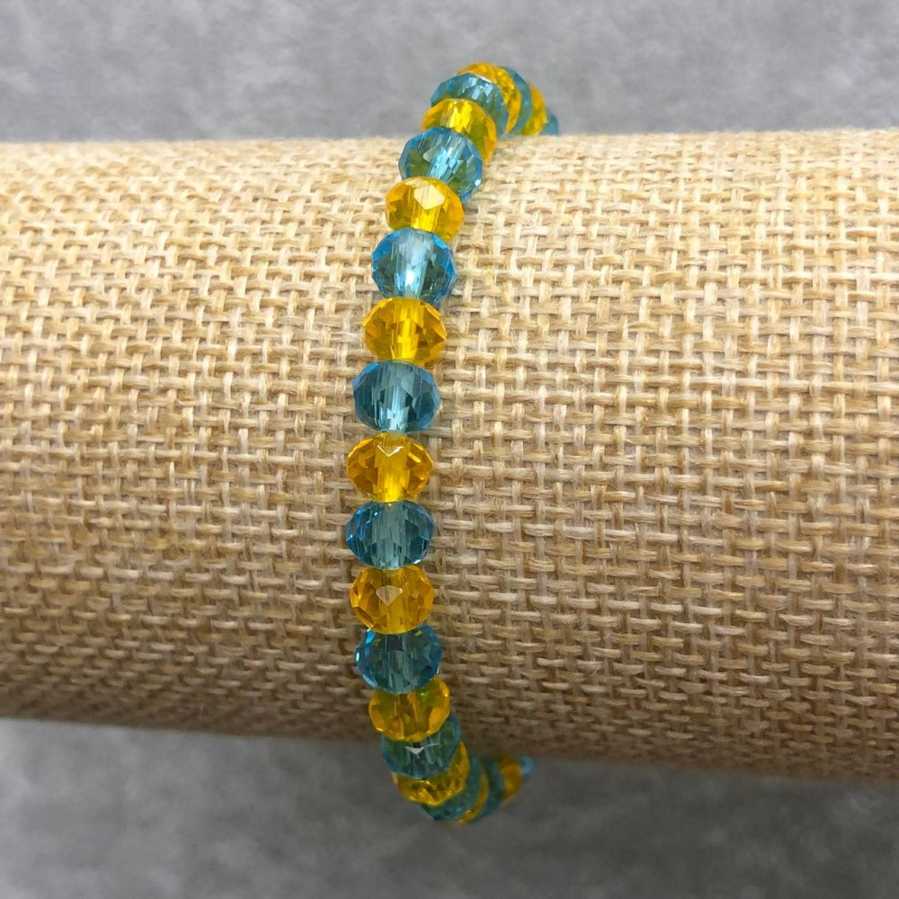 Elastic bracelet with Czech crystal Ukraine faceted rondel, diameter 6×4 mm, length 18 cm