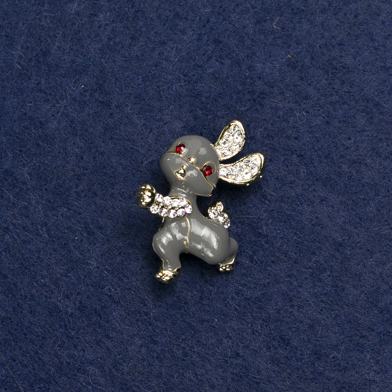 Brooch 'Bunny' in golden metal, enamel and crystals 24x21 mm +