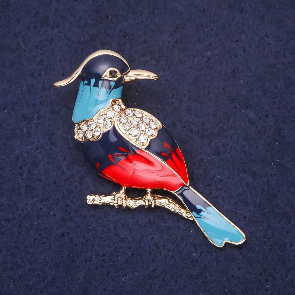 Brooch 'Ibis Bird' with rhinestones, colors light blue, blue, red and white, 45x25 mm, gold-tone metal