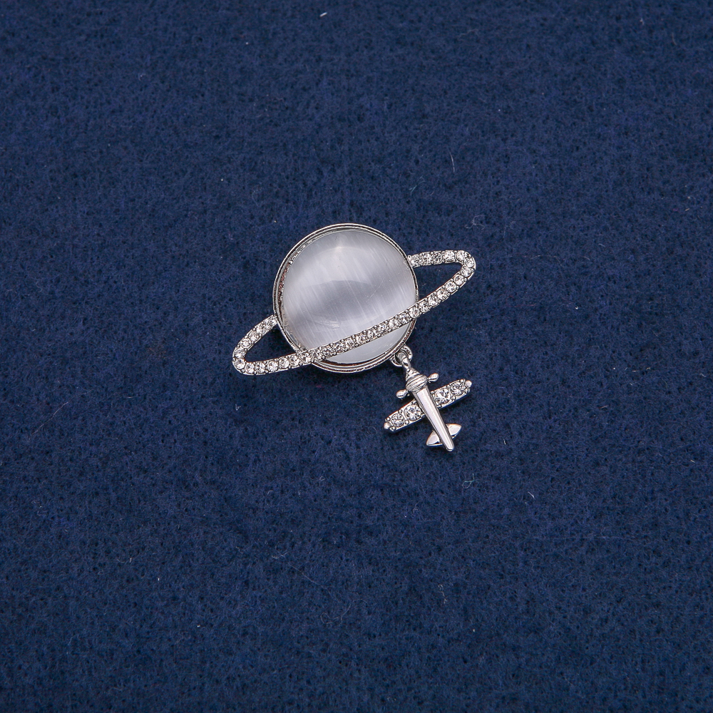 Brooch Saturn Cat's Eye (silver) with plane motif, silver metal with white crystals 35x20mm