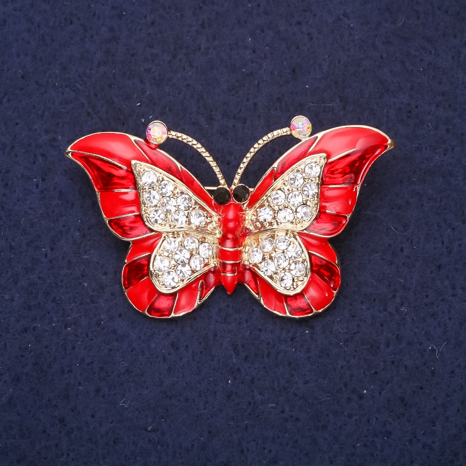 Butterfly Brooch with red enamel and white crystals, 45x28mm, yellow metal