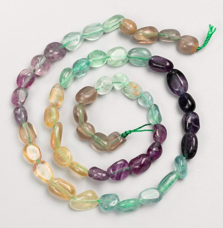 Beads on a string of natural fluorite, tumbled, 7×11–6×7 mm, length 41 cm