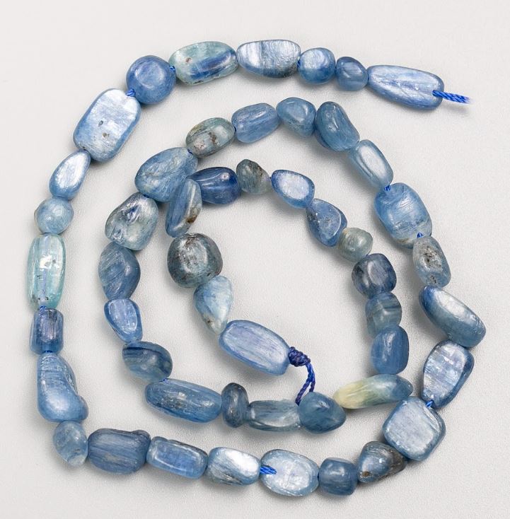 Natural kyanite beads on thread, with a tumbled finish, sizes 8x11–6x7 mm, length 40 cm