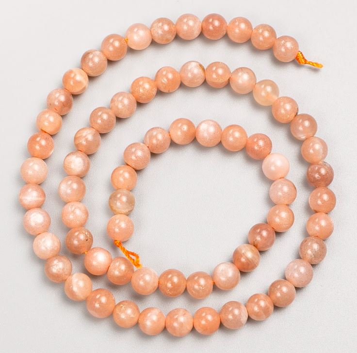 Beads on a thread of natural stone Selenite, smooth sphere, diameter 6 mm, length 39 cm