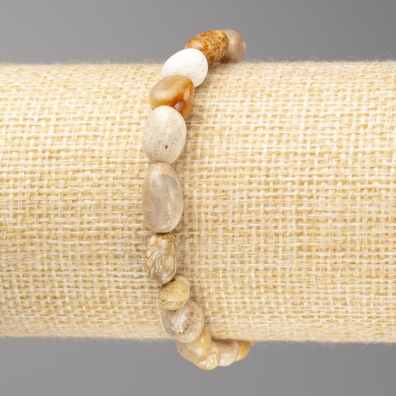 Bracelet with fossilized coral faceted beads, diameter 7x10 mm ± on elastic, length 18 cm+
