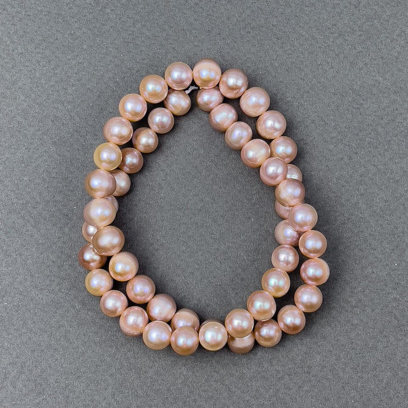 Peach freshwater pearls on a thread, diameter 9x8 mm, length 40 cm