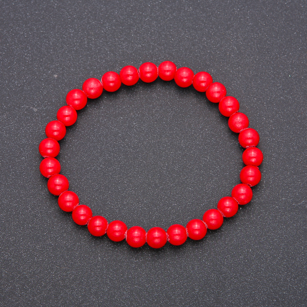 Bracelet made of natural coral pressed on elastic — smooth bead, diameter 6(±)mm, length 18cm